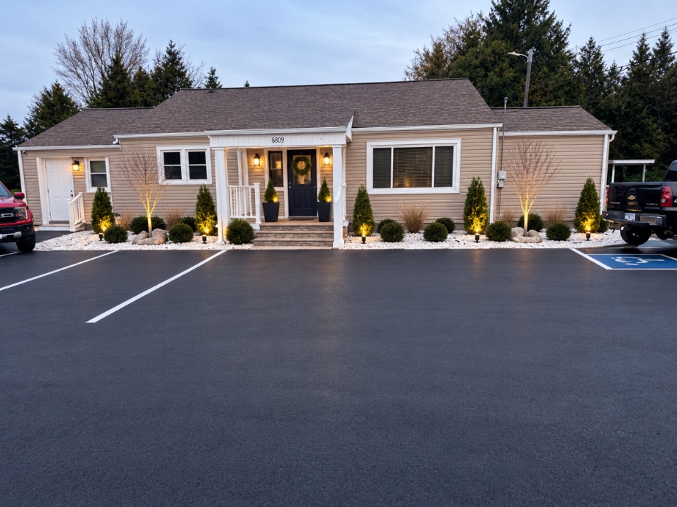 Insurance Specialists of the South office with its illuminated entrance at 6809 Asheville Highway in Knoxville