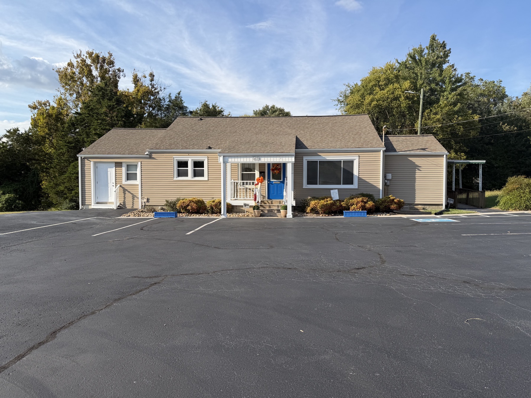 Insurance Specialists of the South office with its blue front door at 6809 Asheville Highway in Knoxville