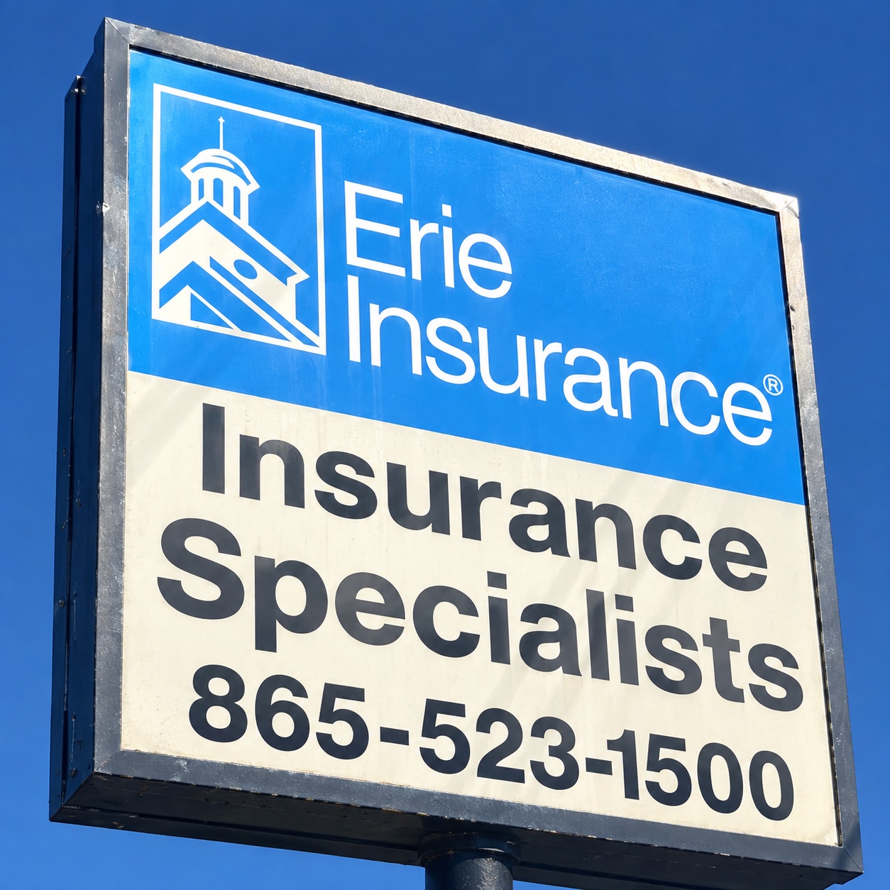 Roadside Erie Insurance and Insurance Specialists sign with office phone number 865-523-1500